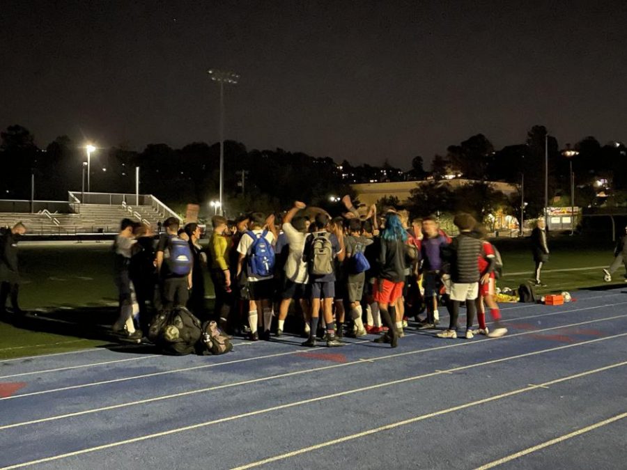 At the end of tryouts, players and coaches rally together as Scots.