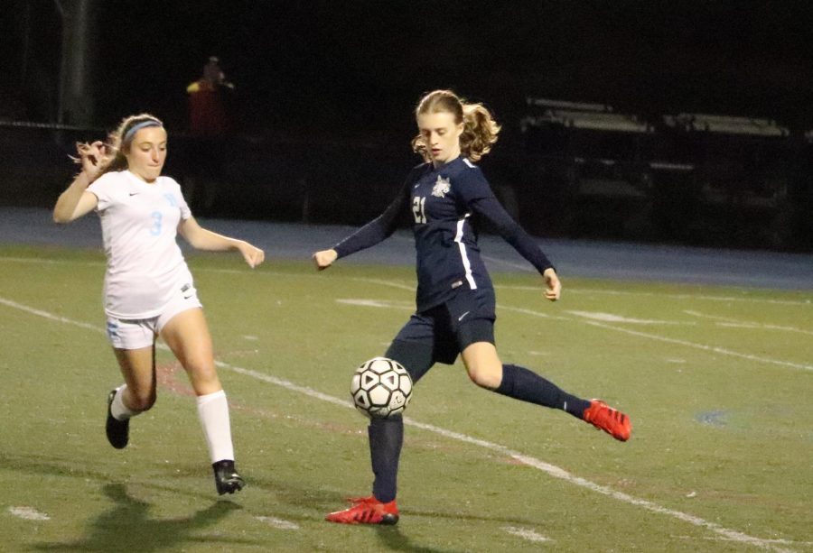 Sophomore Skylar Cottell prepares to kick the ball down the field. 