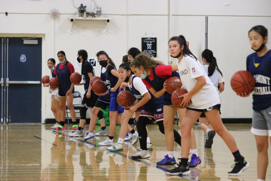 Players line up on the baseline to dribble the length of the court.