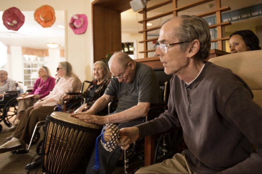 Nursing home patients play music together to help engage them and encourage a sense of community.