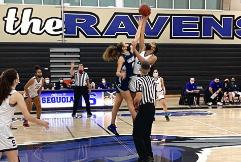 Ravens’ Aniyah Hall wins tip-off against Scots’ Joslyn Moore. 