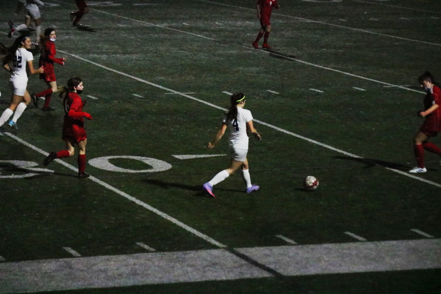 Carly Foehr dribbles ball to the goal