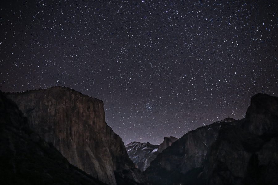 Stars light up the sky over Yosemite National Parks Cathedral Rocks. 