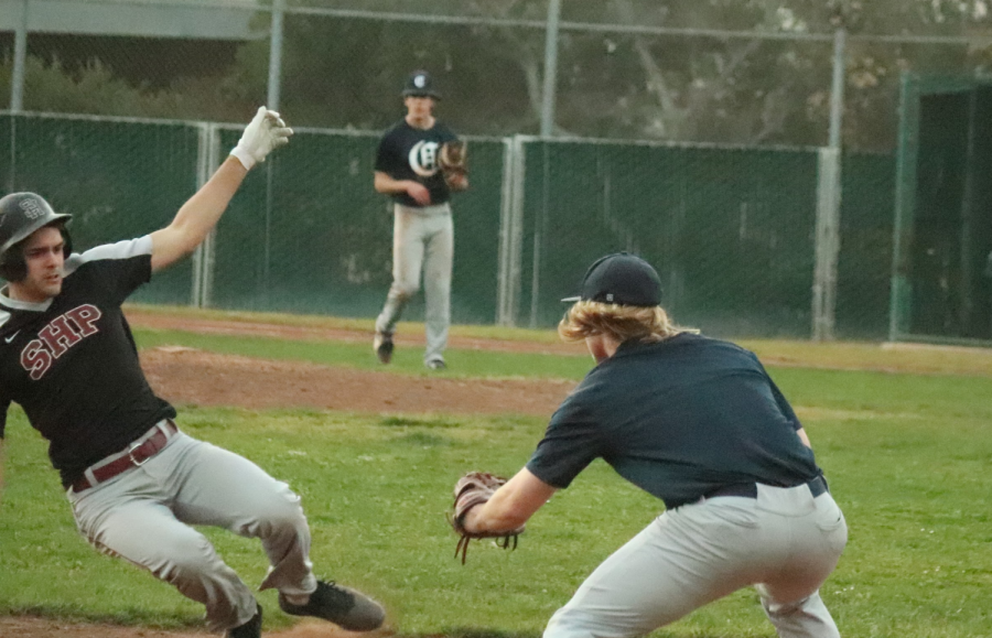 Senior third basemen Colton Fisher completes a double play after a putout and an outfield assist from center fielder Colin ODriscoll.