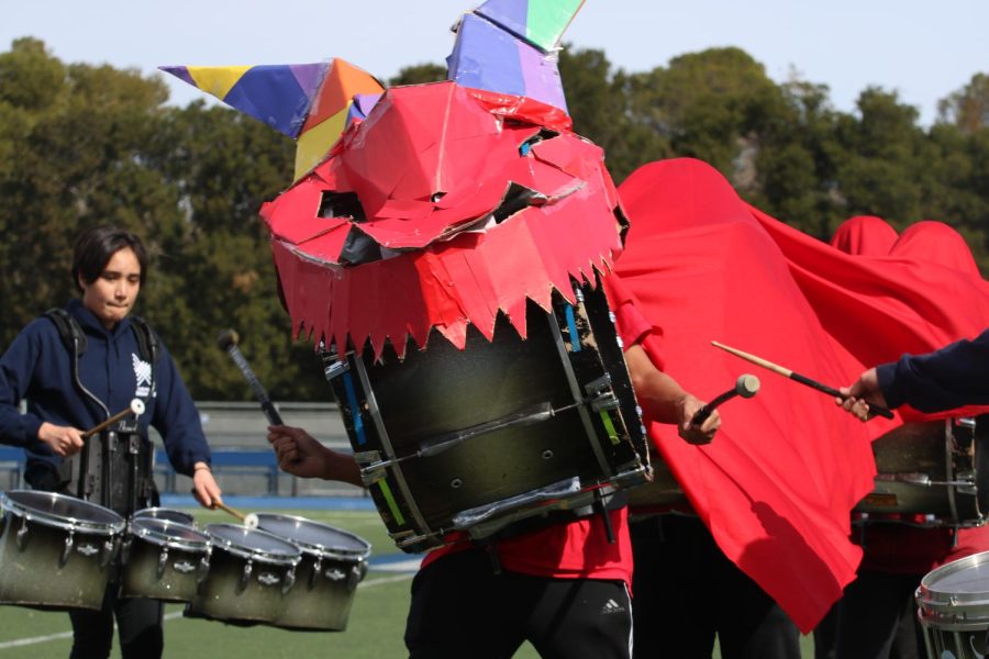 The drumline at Carlmont dons a dragon costume from Chinese culture.