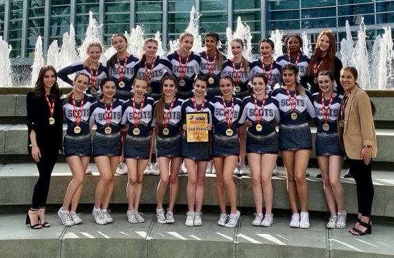 The Lady Scots pose in front of the Anaheim Convention Center after taking home second place at USA Spirit Nationals. I was so excited when I was smiling for this. I felt so accomplished and proud, said Sophia Smith, a junior.