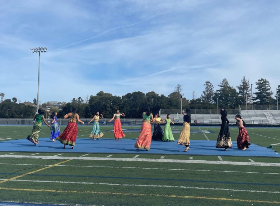 Indian Club performs a dance to Bollywood music wearing traditional Indian clothing.