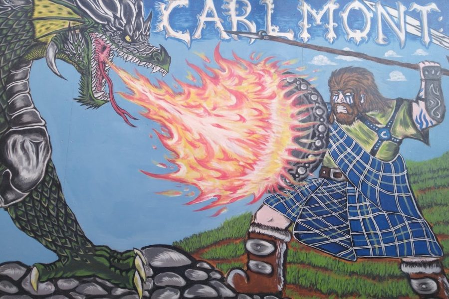 The Carlmont - Home of the Scots mural near the Student Union depicts a traditionally dressed Scots fighting a dragon. In Monty being part of school pride, people may view this as glorifying a culture. 