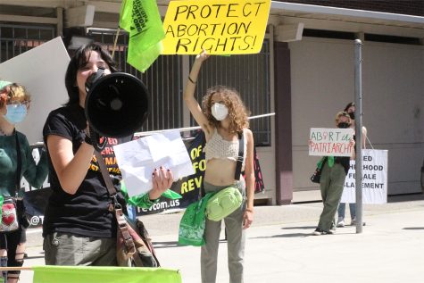Protesters speak out against the recent anti-abortion legislation from the Supreme Court.