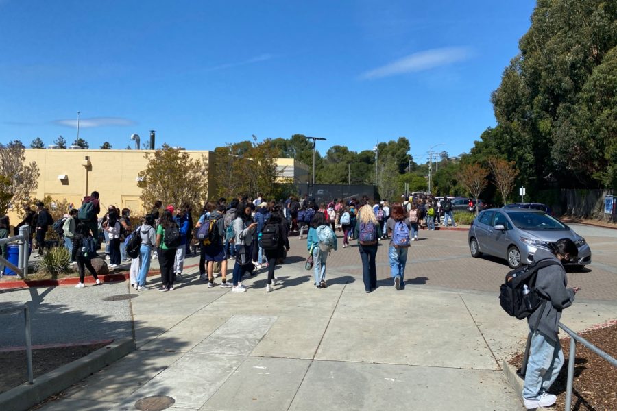 Following instructions from law enforcement, students head south upon leaving campus. Police and Carlmont staff were stationed at intersections to direct traffic.
