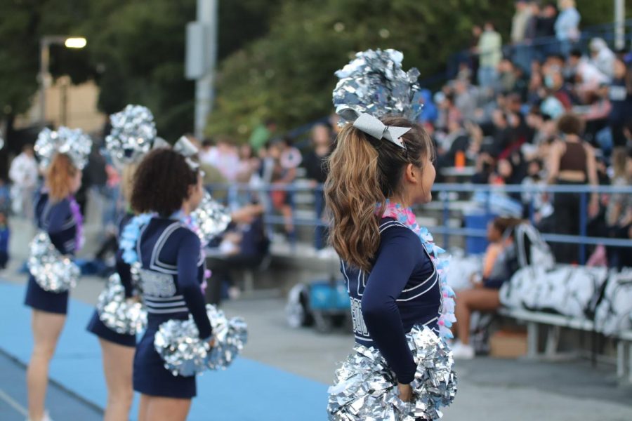 Carlmont cheerleaders perform a routine for the crowd.