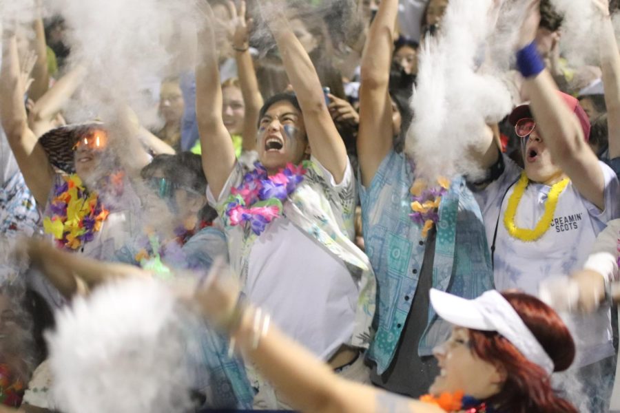 Carlmont students participate in the powder toss, which usually occurs near the end of the game.