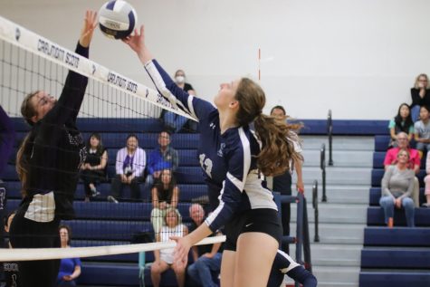 Junior Evelyn Welton reaches for the ball. 