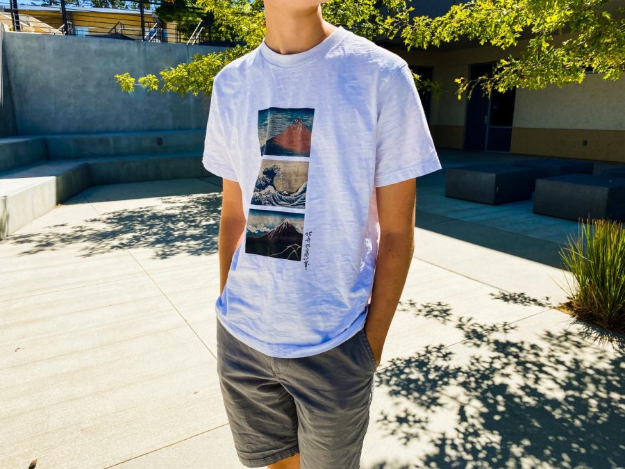 A Carlmont student wearing a Ukiyo-e UT shirt, a new trendy design created by Uniqlo.