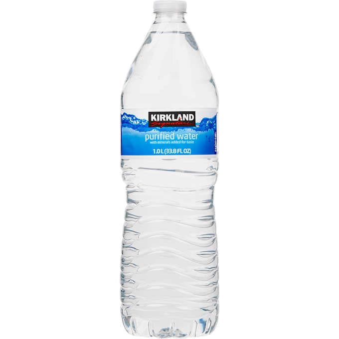 A Kirkland water bottle behind  a white background