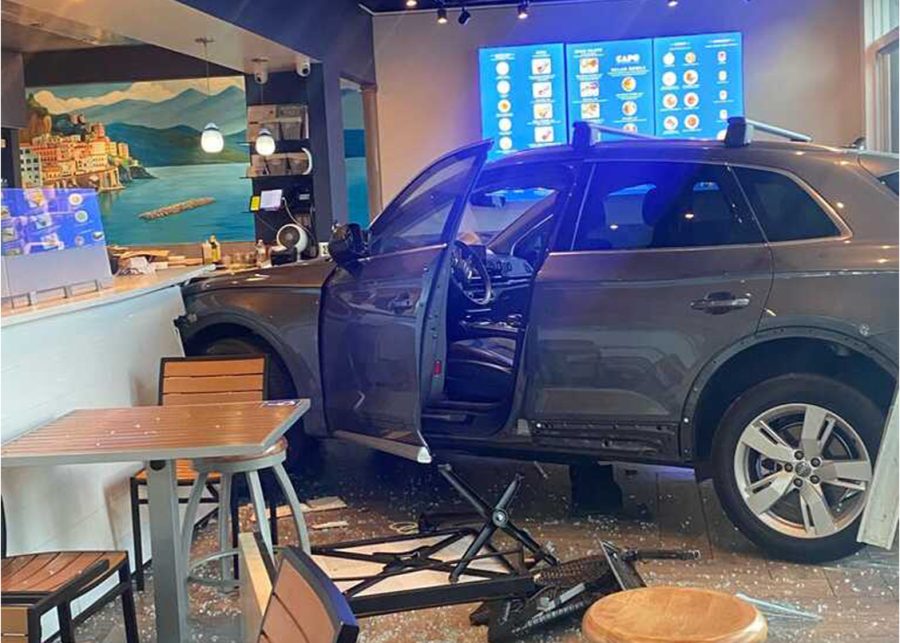 A car crashes into local restaurant CAPO in Belmont. The photographer was granted anonymity with Carlmont Medias Anonymous Sourcing Policy.