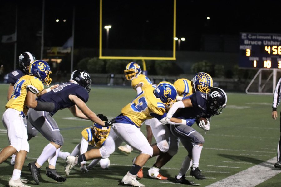 Santa Clara High Schools defense attempts to tackle wide receiver, Austin Li. 