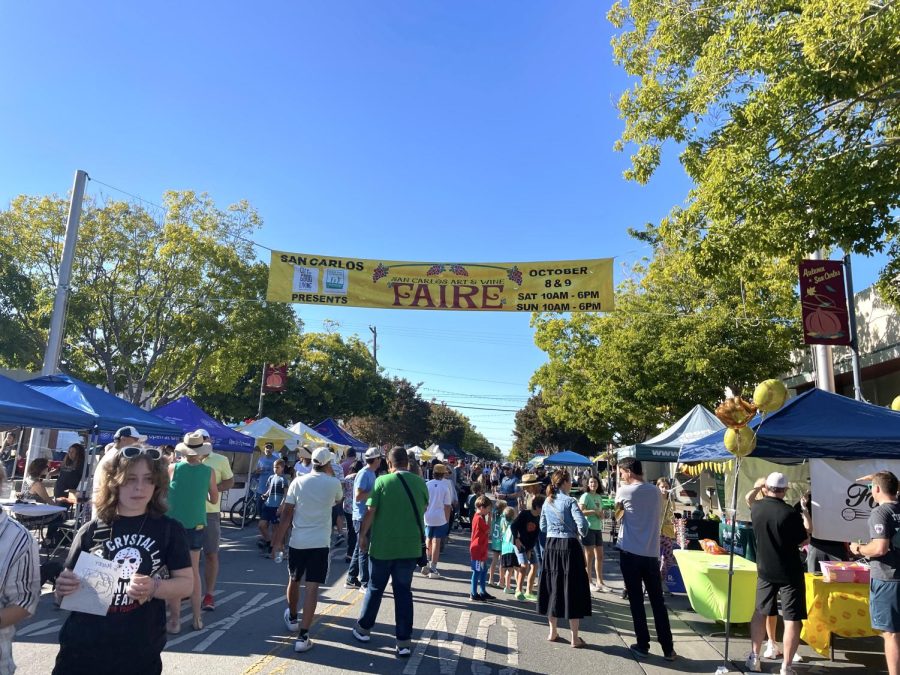 Locals and out-of-towners interact with the large variety of stands along Laurel St. on Saturday, Oct. 8, the first day of the San Carlos Art and Wine Faire. Many people find acquaintances and friends within the thousands of attendees. 