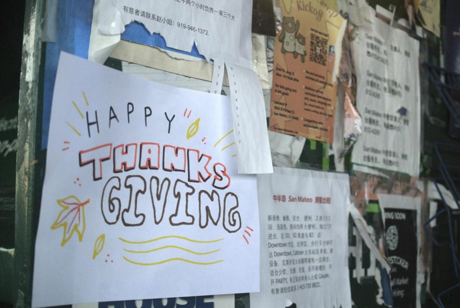 A Happy Thanksgiving sign welcomes Marina Grocery clients.