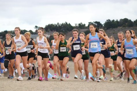 Varsity girls cross country runners start their final race before Central Coast Section (CCS). 