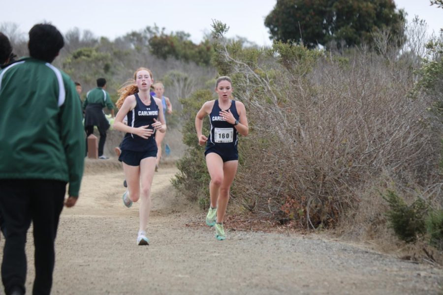 Juniors Sienna Reinders and Charlotte Gordon turning the corner into the final mile.