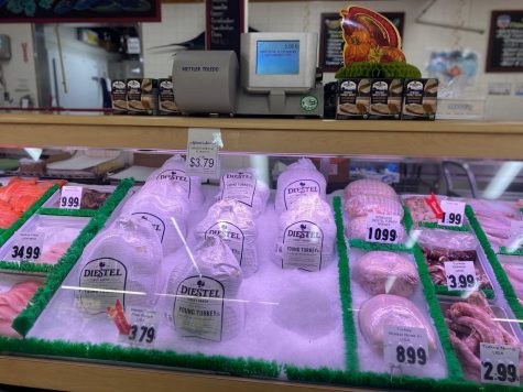 A supermarket sells multiple varieties of turkeys in preparation for Thanksgiving.