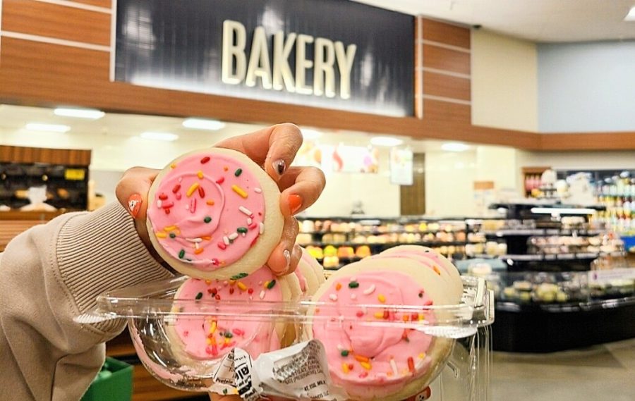 A customer lifts the controversial frosted sugar cookies at a grocery store. Originally invented by Lofthouse, grocery stores have created their own spin-offs of this highly-debated cookie. 