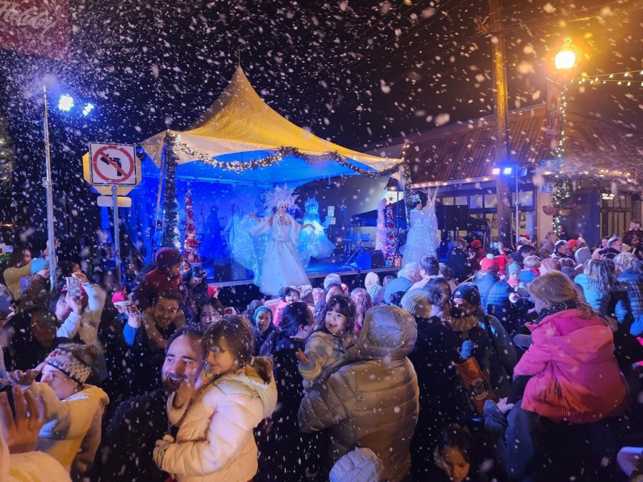 Soapy snow falls on the audience at the Night of Holiday Lights.