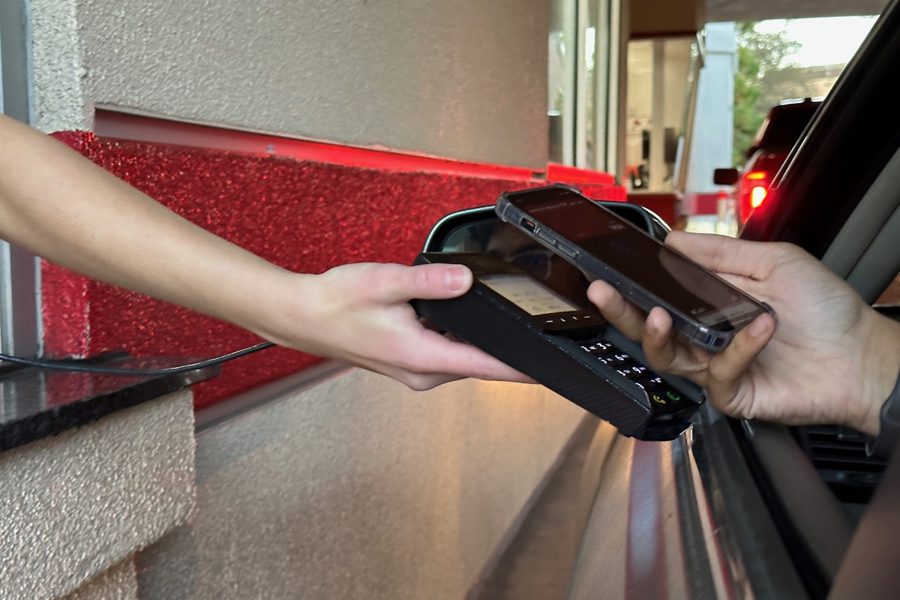 Touchless payments are accepted at businesses all over the globe, both at the register and the drive-thru.