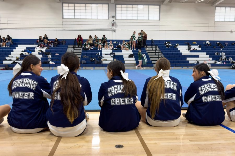 Cheerleaders on the JV competition team get ready to watch and support the varsity team as they perform.
