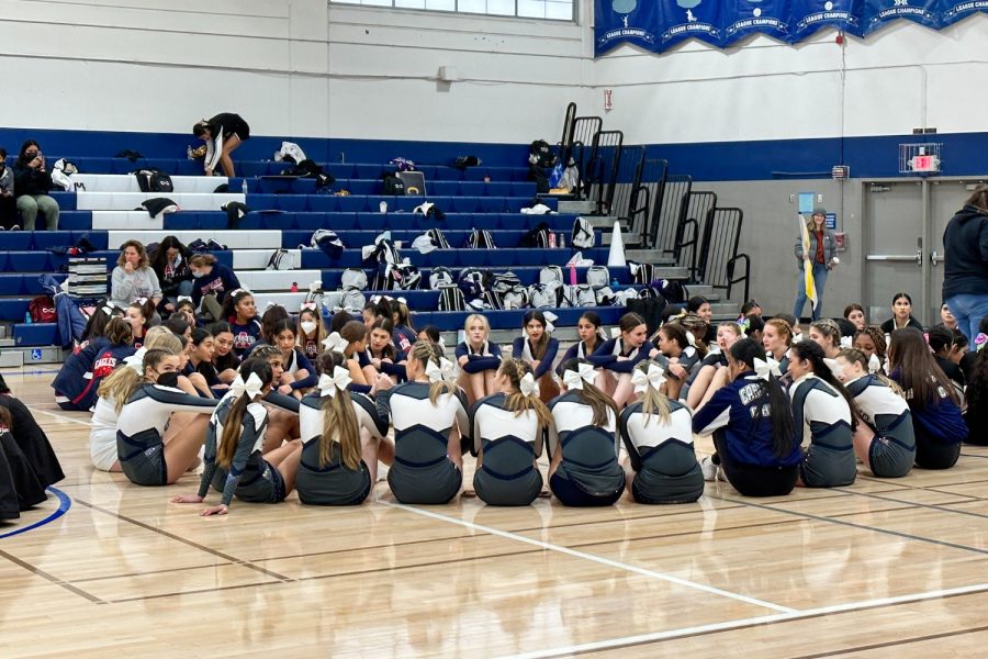 The varsity and JV cheer teams wait for the results of the competition.