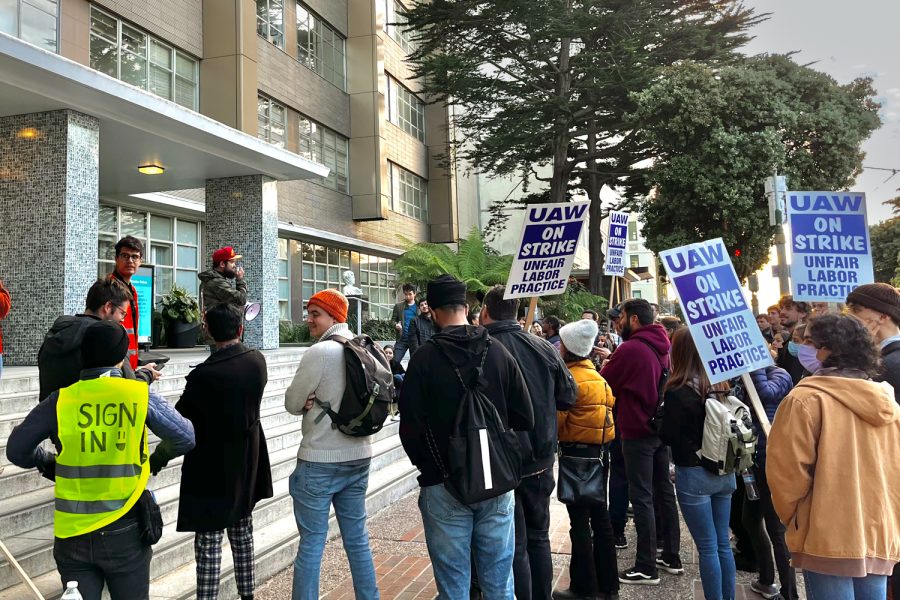 Ready for action: The crowd of protesters in front of the UCSF Sol Silverman Oral Medicine Clinic listen to speakers after marching in organized groups while holding signs with “Honk 4 Living Wages” and “On Strike: Unfair Labor Practice.” It is their fourth day outside, and the speaker empowers the crowd to bring more pots, pans, or anything else that makes noise to the upcoming rallies.  