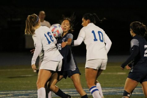 Freshman forward Lindsay Wong fights for the ball in the midfield.