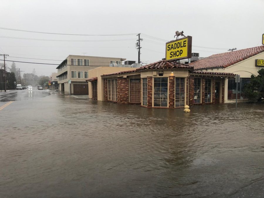 Flooding occurs on New Years Eve outside of Olsen Nolte Saddle Shop on the corner of Central Avenue and El Camino Real in San Carlos.