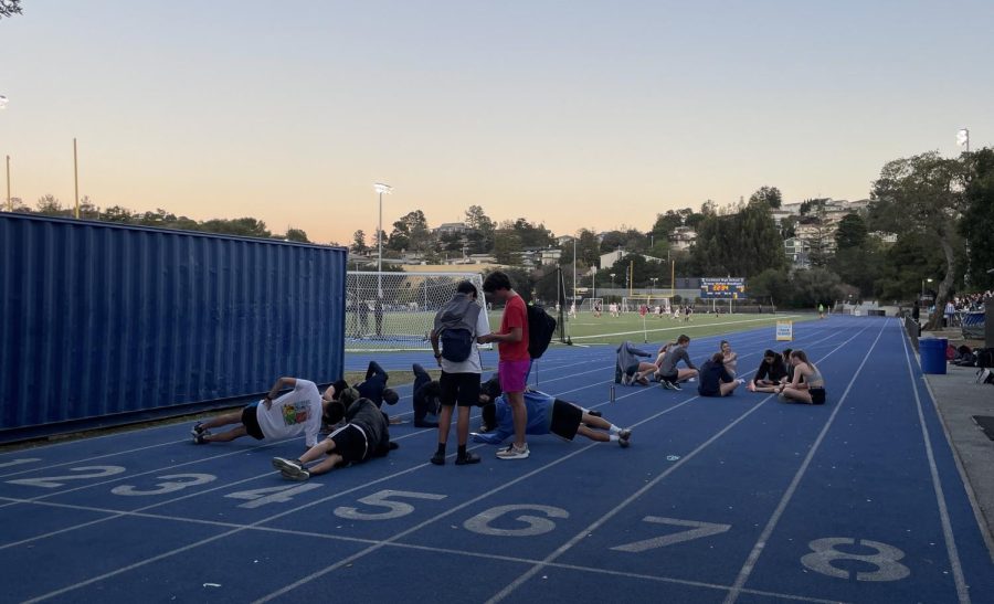 The+track+and+field+team+ends+their+practice+with+stretching+and+a+little+bit+of+conditioning.+