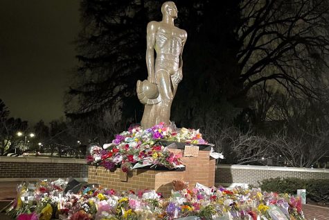 Bouquets of flowers were placed around the Spartan Statue at Michigan State University following the Feb. 13 shooting.