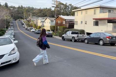 Calmont sophomore Anya Mele crosses the street outside of a crosswalk. As of Jan. 1, it is legal to do this as long as there is no danger of collision. 