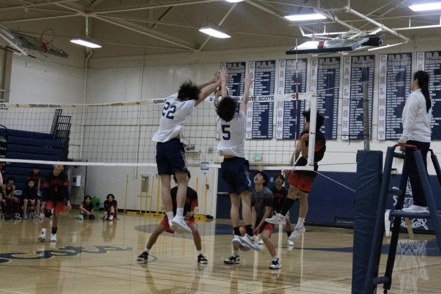 Junior hitters Eli Nathan and Kevin Tomita block San Mateo. “We wanted to play strong, weve seen them play before so we knew it was gonna be an extremely tough game, we just had to play our game,” Tomita said.