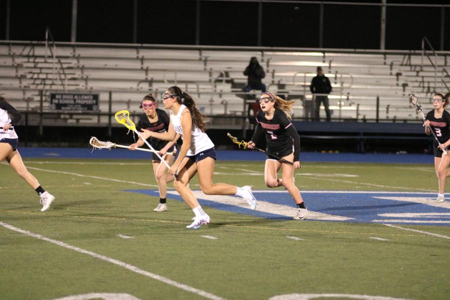 Sophomore Isabella Rice sprints toward the goal on a counterattack.