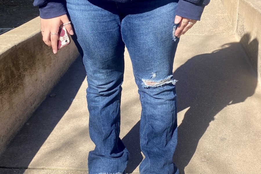 A Carlmont student wears bootcut jeans to school, a trend that originated in the 70s but has since returned.