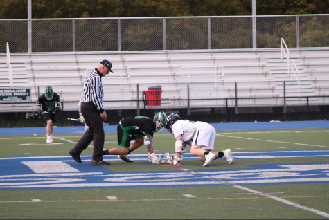 Sophomore Charlie Wescott gets ready for the faceoff to start the game.