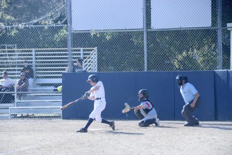 Sophomore Daniella Smit hits a line drive to center field.