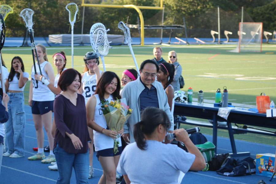 Senior Katherine Yu and her parents pose for a picture.