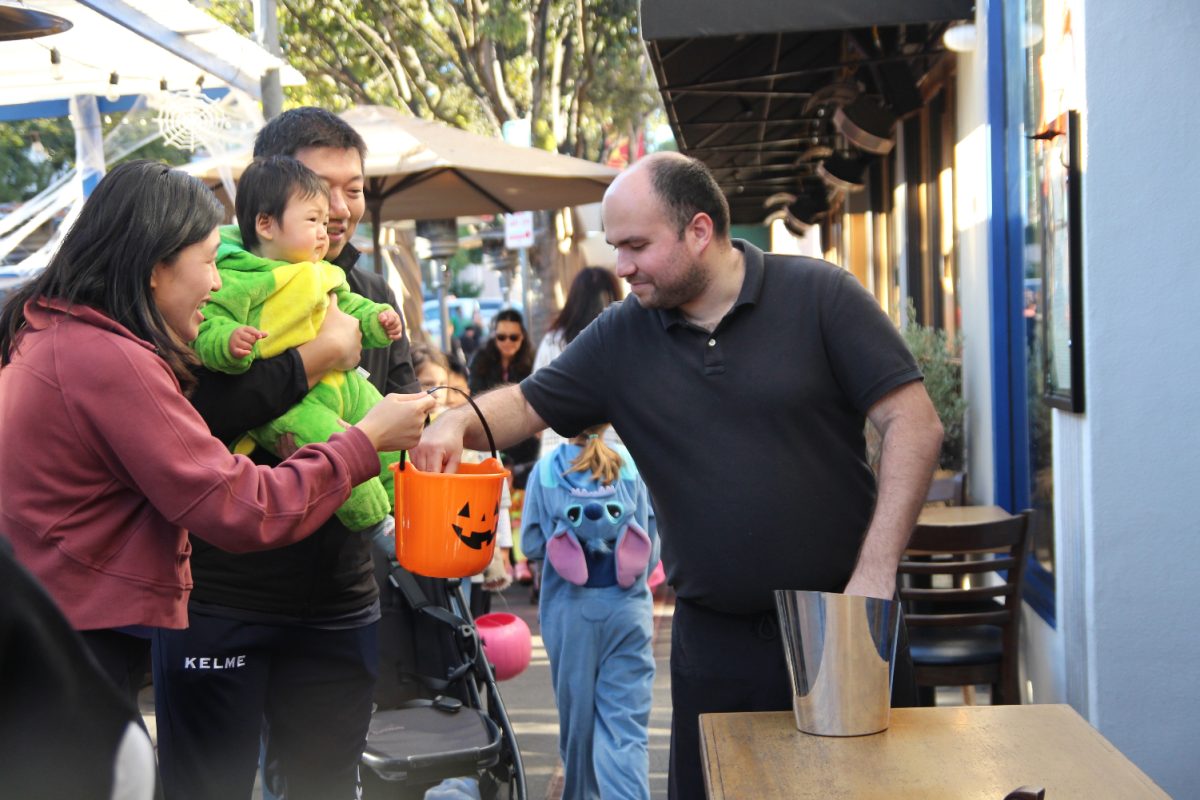 Families trick-or-treat down Laurel Street at the Goblin Walk
