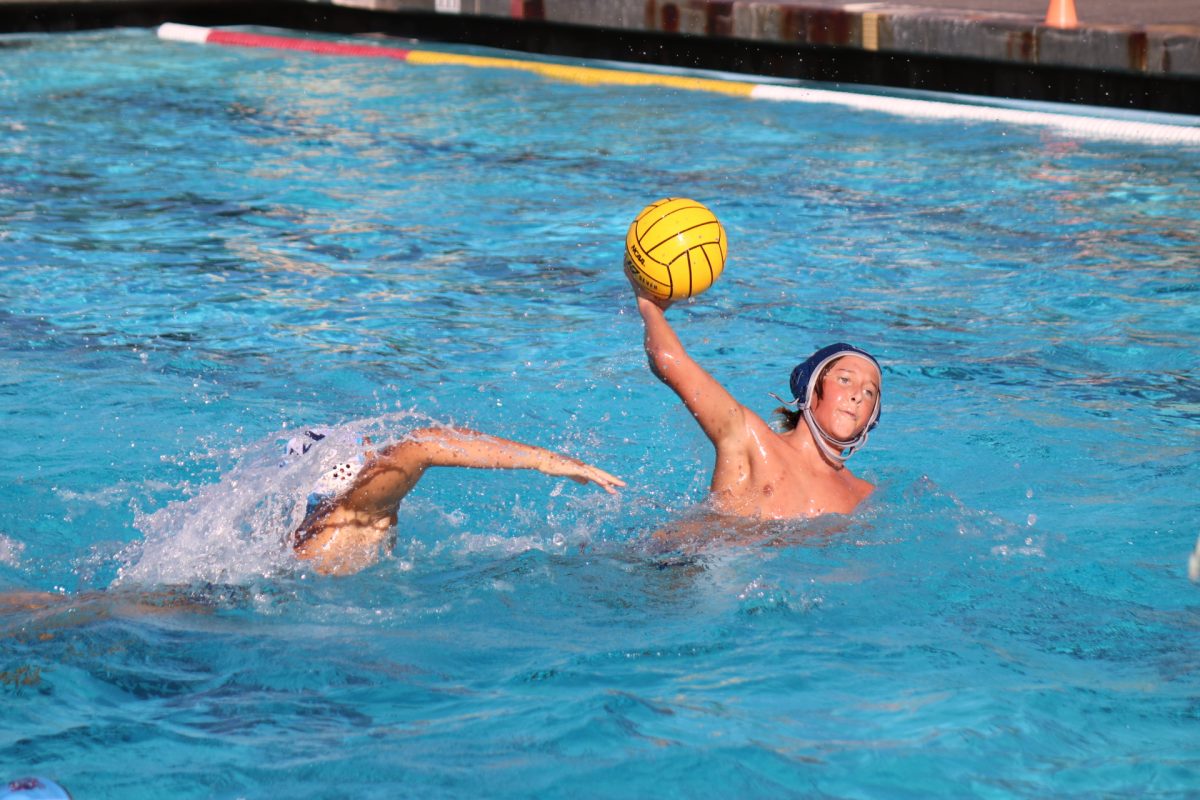 Sophomore captain Keegan Sullivan swims past Hillsdale defense and prepares for a shot. 