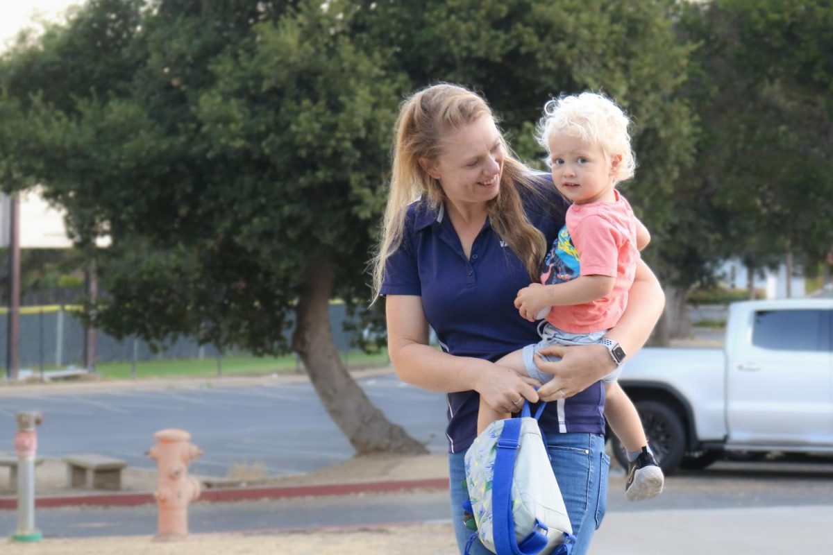 Teacher and water polo coach Justine Hedlund drops her child off at Carlmont High Schools onsite daycare center on a Thursday morning. The daycare has made my schedule as a working parent a lot easier to manage, Hedlund said.