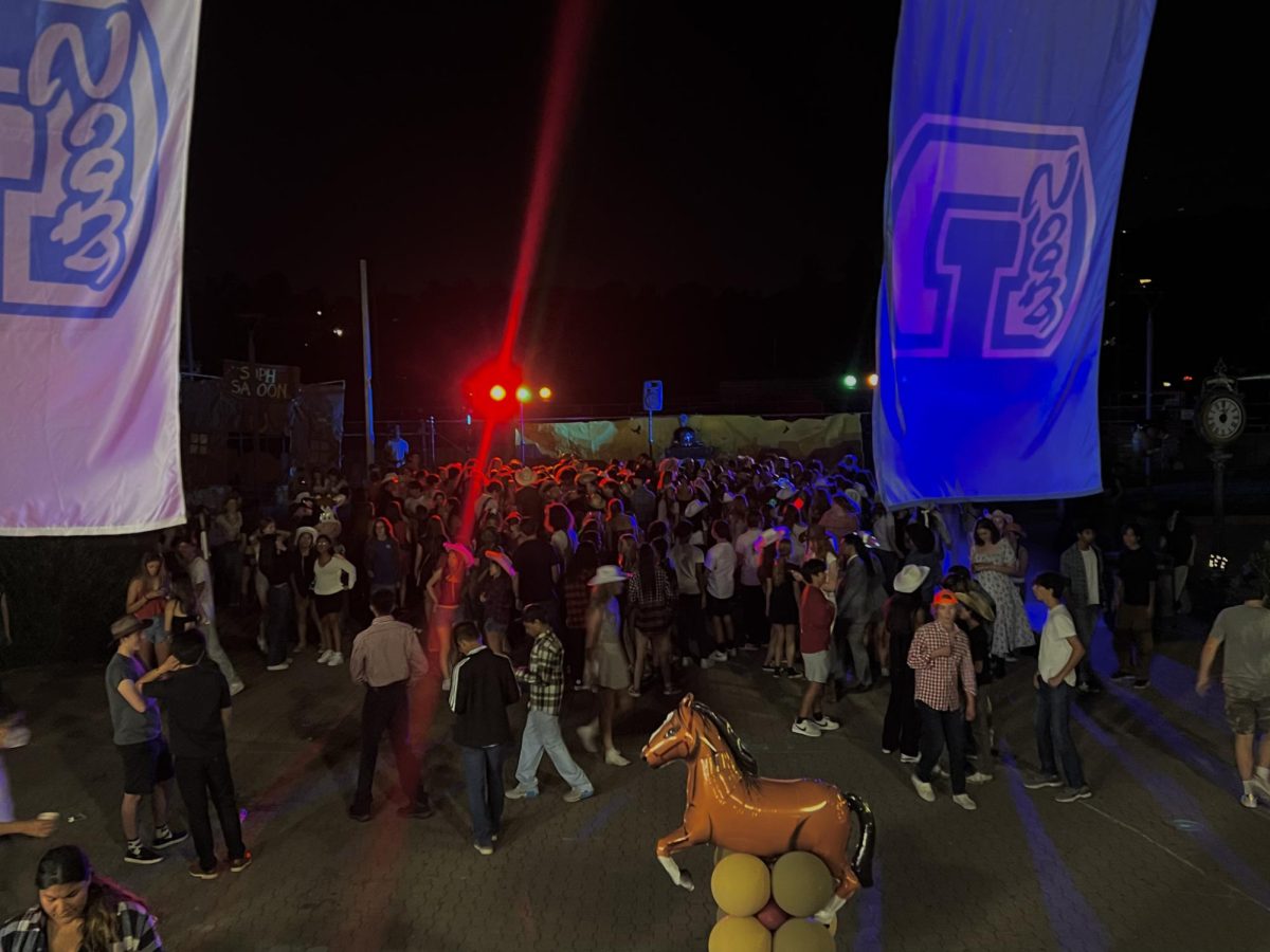 Students dance in the Quad at the 2023 Homecoming dance. Carlmont Athletic director Jim Kelly said that many did not want the dance to be over. We had students asking the DJ if he could play one more song, Kelly said.