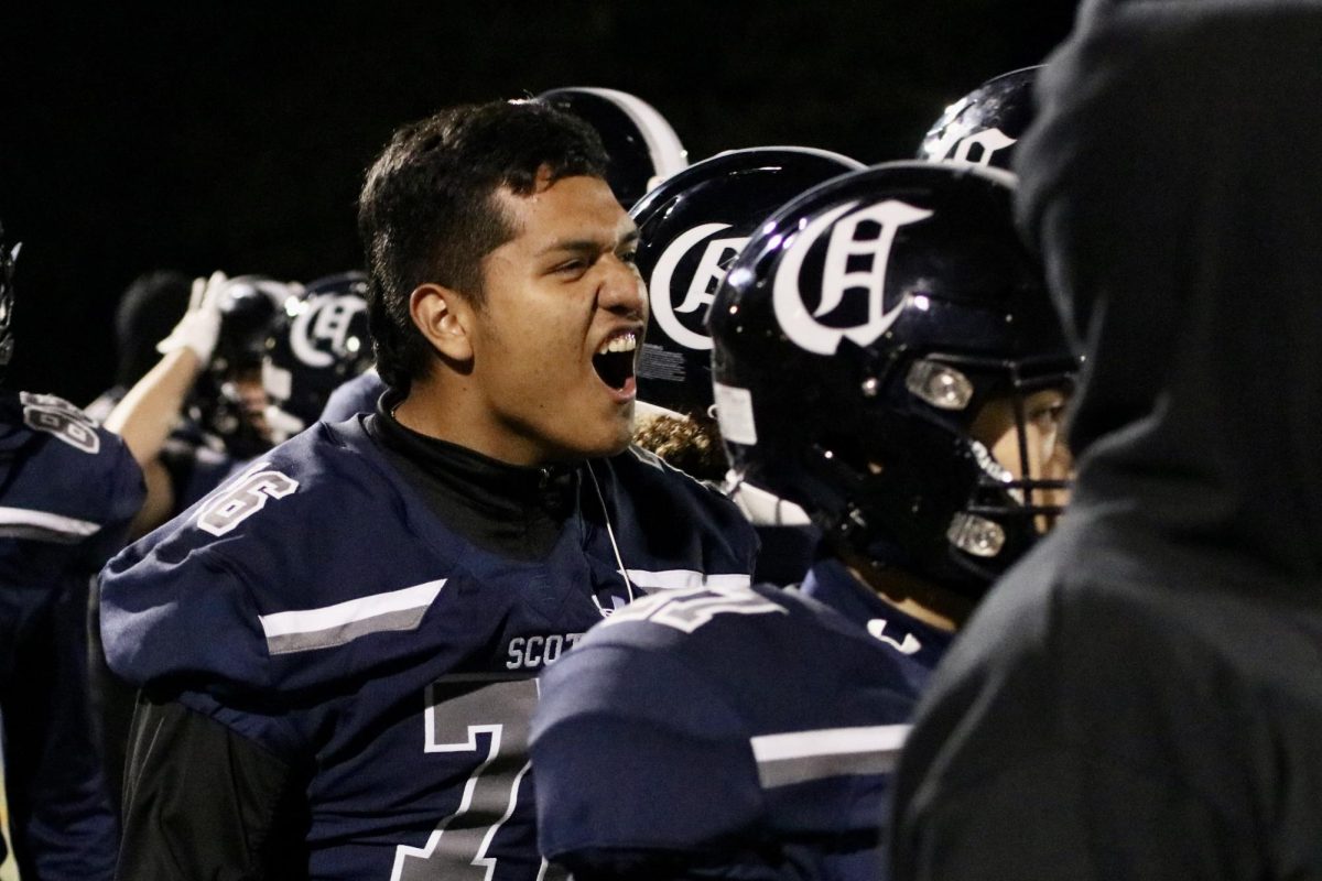 Offensive lineman Erik Chaparro-Hernandez roars in support of his team in the third quarter. The Scots were ahead 30-14 in the beginning of the quarter. They maintained a lead all the way to the end of the game. 