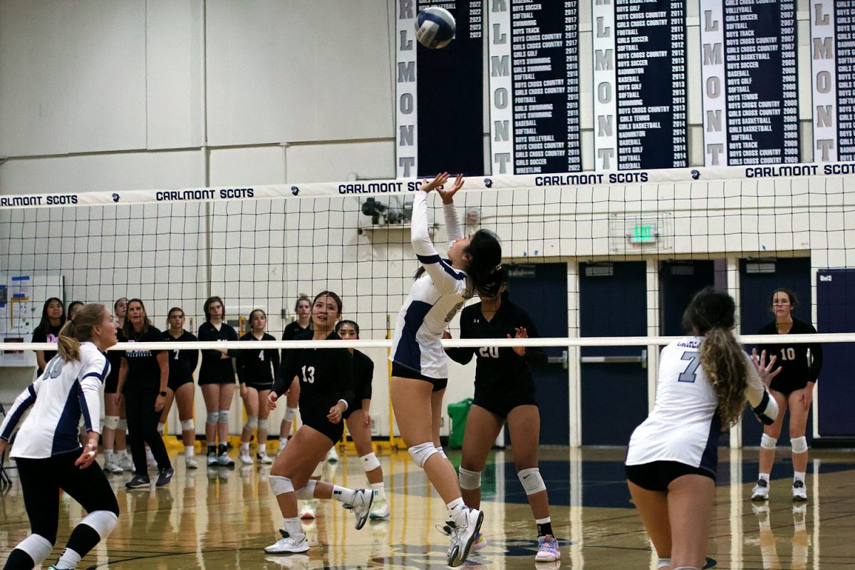 Senior Allison Hoang sets the ball up toward a teammate who is preparing to jump for a hit. Hoang was influential on the court as she was able to distribute the ball for the more offensive players. The setters performed well during this game, giving the outside hitters many opportunities to gain points.