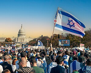 People march to the capital building in Washington D.C to protest the war. Protesters rally in front of the White House in Washington, D.C., in support of Palestinian resistance to Israel during the 2023 Israel-Gaza war by Ted Eytan with Wikimedia Commons is licensed under CC BY-SA 4.0.
